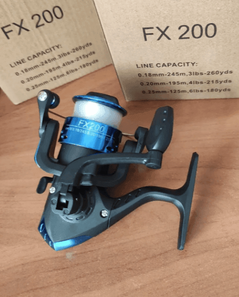 Котушка "економ" FX-200 1bb пластик Multic(кнопка) з волосінню